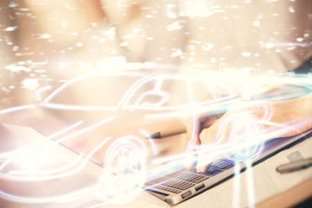 Double exposure of woman hands typing on computer and automobile theme drawing. High Tech concept.の写真素材