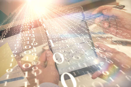 Multi exposure of man's hands holding and using a digital device and data theme drawing. Innovation...
