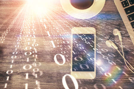 Double exposure of technology theme drawing over work table desktop. Top view. Global data analysis...