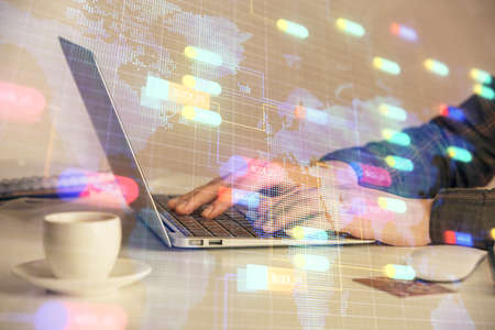 Multi exposure of woman hands working on computer and data theme hologram drawing. Tech concept.