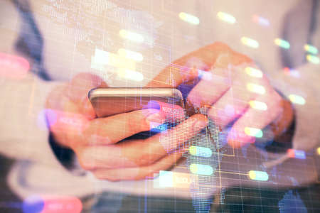 Multi exposure of man's hand holding and using a digital device and data theme drawing. Innovation...