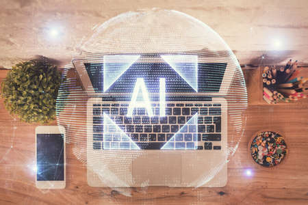 Double exposure of data hologram sketch over study table background with computer. Concept of Ai. Top view.の写真素材