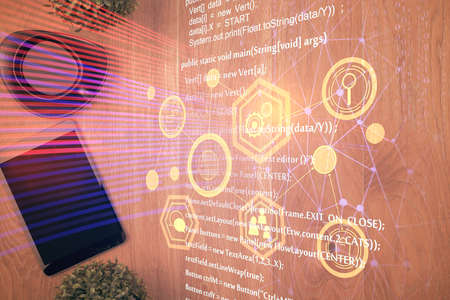 Double exposure of technology theme drawing over work table desktop. Top view. Global data analysis...