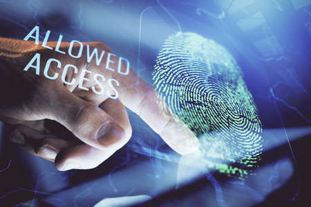Double exposure of man's hands holding and using a digital device and fingerprint hologram drawing....