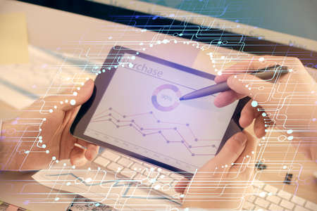 Multi exposure of man's hands holding and using a digital device and data theme drawing. Innovation concept.の写真素材