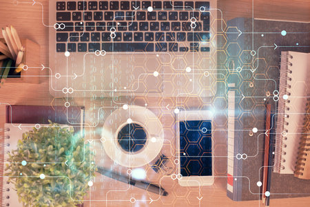 Double exposure of technology theme drawing over work table desktop. Top view. Global data analysis concept.の写真素材