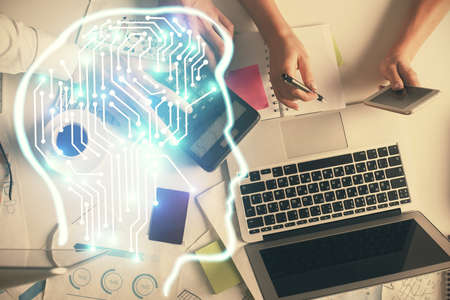 Double exposure of man and woman working together and human brain hologram drawing. Brainstorm...