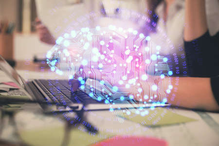 Multi exposure of woman hands working on computer and brain hologram drawing. Ai concept.の写真素材