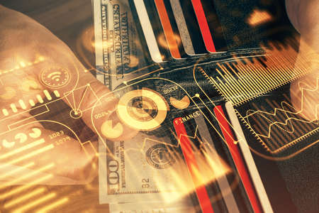 Multi exposure of Tech drawing hologram and USA dollars bills and man hands. Technology concept.