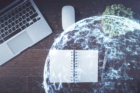Social network hologram drawings over computer on the desktop background. Top view. Double exposure.