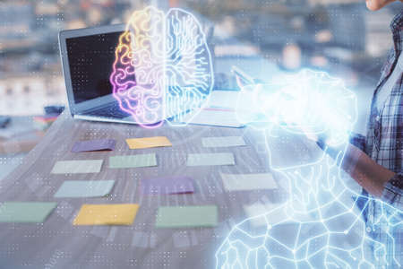 Double exposure of woman hands typing on computer and man in AR glasses drawing. Education concept.