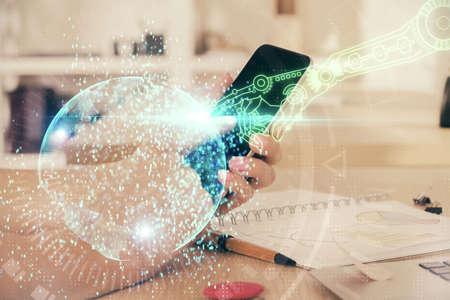 Double exposure of man's hand holding and using a digital device and data theme drawing. Technology...