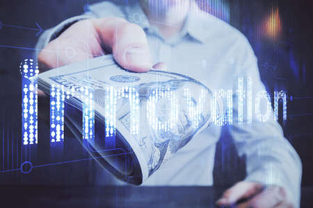 Double exposure of technology drawing hologram and us dollars bills and man hands. Data concept