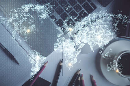 Social network hologram drawings over computer on the desktop background. Top view. Multi exposure. Concept of people connection.の写真素材