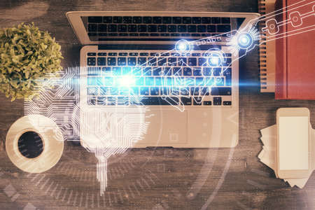 Double exposure of brain drawing hologram over topview work table background with computer. Concept...