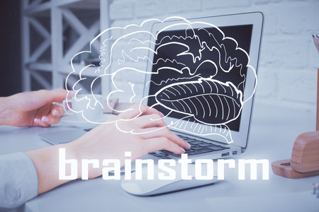 Double exposure of woman hands typing on computer and creative drawing. Start up concept.の写真素材