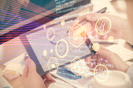 Multi exposure of man's hands holding and using a digital device and data theme drawing. Innovation...