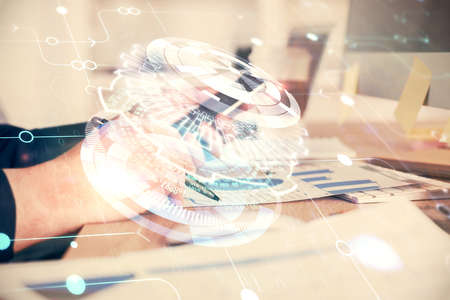 Multi exposure of man's hands holding and using a digital device and data theme drawing. Innovation concept.の写真素材