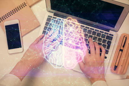 Double exposure of woman working on computer andhuman brain hologram drawing. Top View. Ai concept.の写真素材