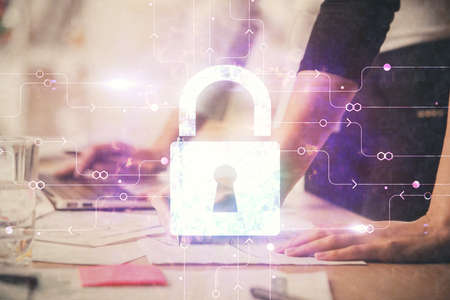 Double exposure of woman hands working on computer and lock hologram drawing. Security concept.