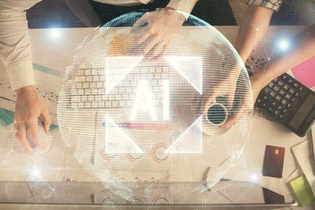 Double exposure of man and woman working together and data theme hologram drawing. Computer...