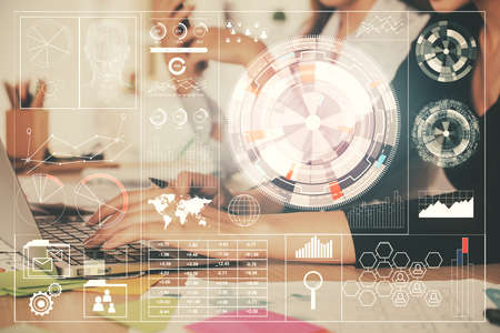Multi exposure of woman hands working on computer and data theme hologram drawing. Tech concept.
