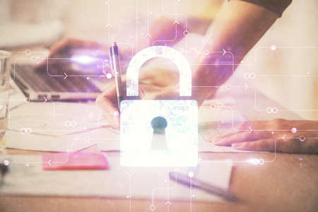 Double exposure of woman hands working on computer and lock hologram drawing. Security concept.