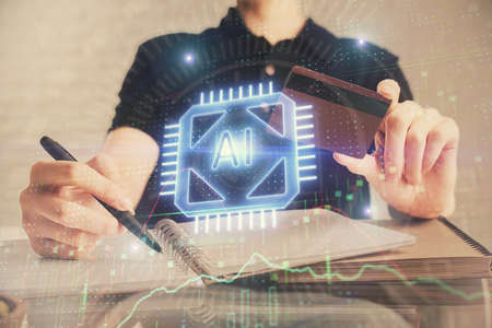 Double exposure of man hands holding a credit card and data theme drawing. E-commerce and technology...