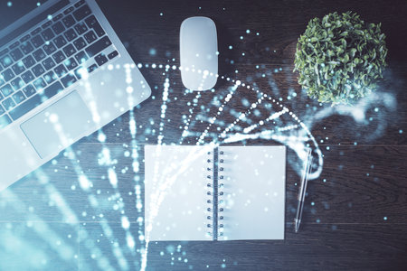 DNA hologram drawings over computer on the desktop background. Top view. Multi exposure. Concept medical education.の写真素材