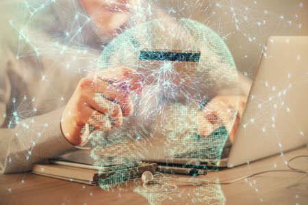Double exposure of man hands typing on computer with credit card and brain theme drawing. E-commerce and AI concept.の写真素材