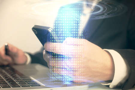 Multi exposure of man's hand holding and using a digital device and data theme drawing. Innovation...