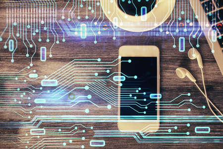 Double exposure of technology theme drawing over work table desktop. Top view. Global data analysis concept.の写真素材