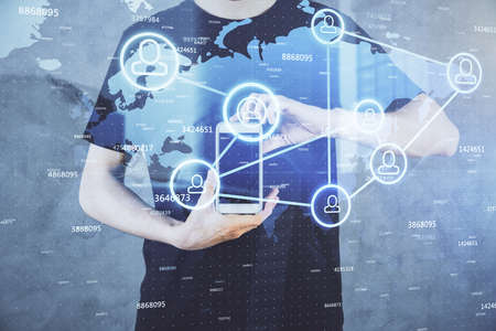 Double exposure of man's hands holding and using a phone and social network theme drawing.の写真素材
