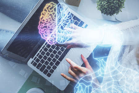 Double exposure of woman hands working on computer and man in ar glasses hologram drawing. Top View....