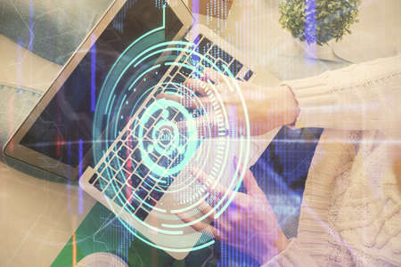 Double exposure of woman hands working on computer and data theme hologram drawing. Top View....