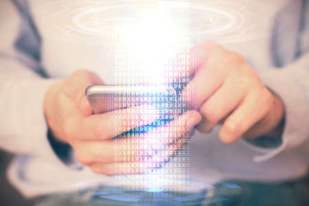 Multi exposure of man's hand holding and using a digital device and data theme drawing. Innovation...