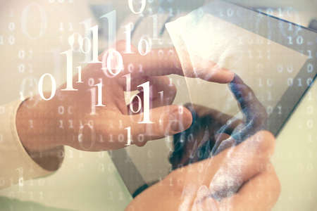 Multi exposure of man's hand holding and using a digital device and data theme drawing. Innovation...