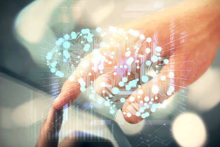 Double exposure of man's hand holding and using a digital device and brain hologram drawing. Data...