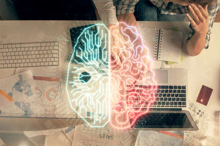 Double exposure of man and woman working together and human brain hologram drawing. Brainstorm concept. Computer background. Top View.の写真素材