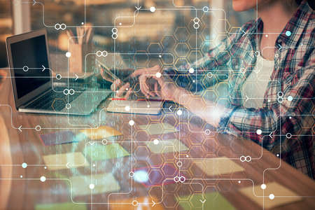 Multi exposure of woman hands working on computer and data theme hologram drawing. Tech concept.