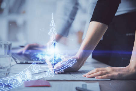 Double exposure of woman hands typing on computer and creative drawing. Start up concept.
