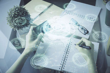 Multi exposure of woman on-line shopping holding a credit card and social network theme drawing....