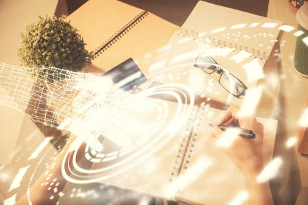 Double exposure of woman on-line shopping holding a credit card and data theme hologram drawing....