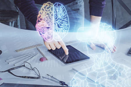 Double exposure of man's hands holding and using a digital device and AR glasses drawing. Virtual...