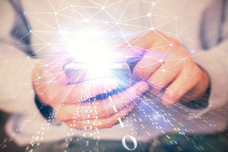 Multi exposure of man's hand holding and using a digital device and data theme drawing. Innovation...