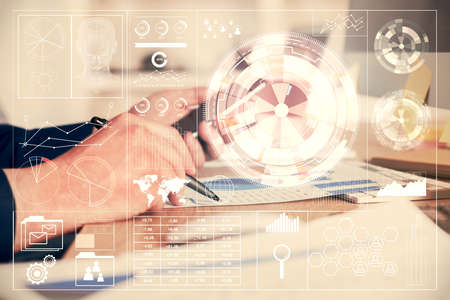 Multi exposure of man's hands holding and using a digital device and data theme drawing. Innovation...