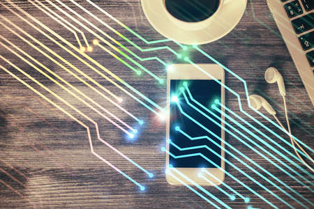 Double exposure of technology theme drawing over work table desktop. Top view. Global data analysis concept.の写真素材