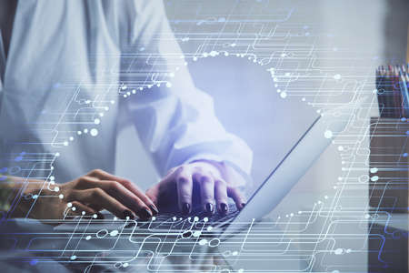 Double exposure of woman hands working on computer and data theme hologram drawing. Tech concept.