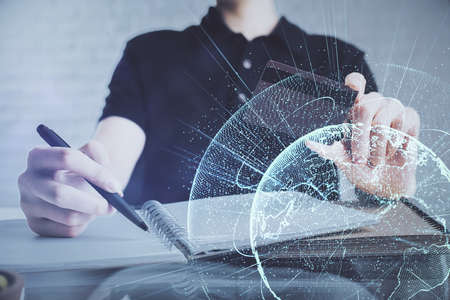 Double exposure of man hands holding a credit card and social network theme drawing. Digital finance and E-commerce concept.の写真素材