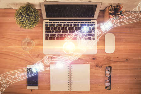 Double exposure of data theme drawing hologram over topview work table background with computer. Concept of technology.の写真素材